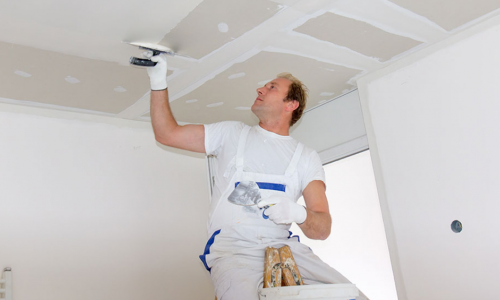 Worker Painting Ceiling