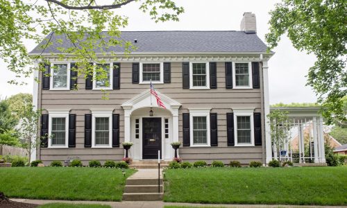 Tan Siding & Black Shutters