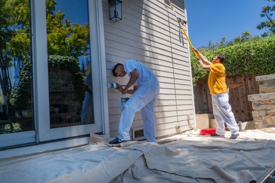 painters painting siding