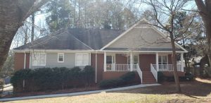 photo of brick home in alpharetta before being repainted