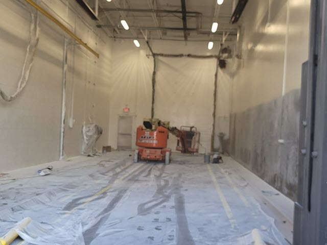 in progress photo of an 18 wheeler truck bay being recoated
