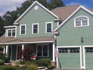 Green and White Siding Painting and Trim