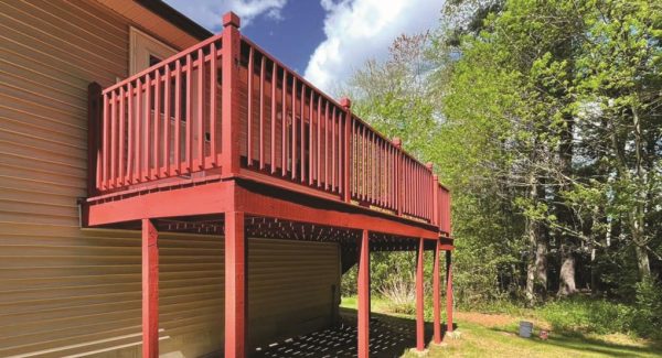 red painted wooden deck off of house