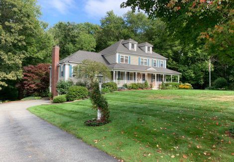 Home exterior before restoration from driveway