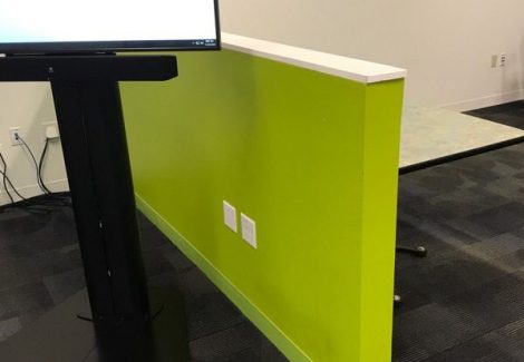 green and white branded conference room