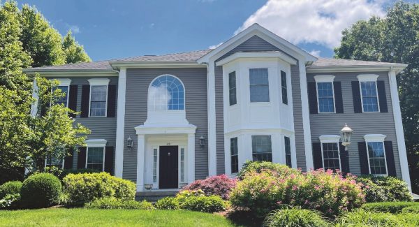 light grey house with white accents and columns