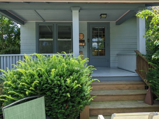 front porch deck and ceiling repainted on shingle home.