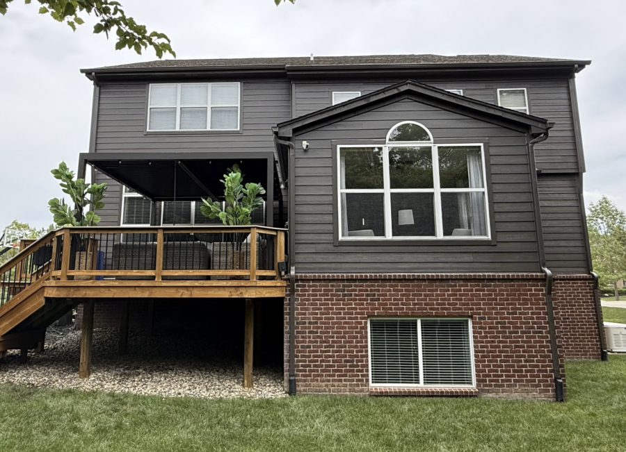 back of house with brick and dark grey painted siding Preview Image 4