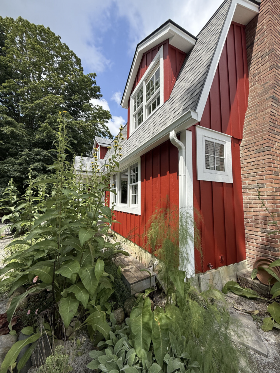 house with red stained wood siding and white trim Preview Image 1