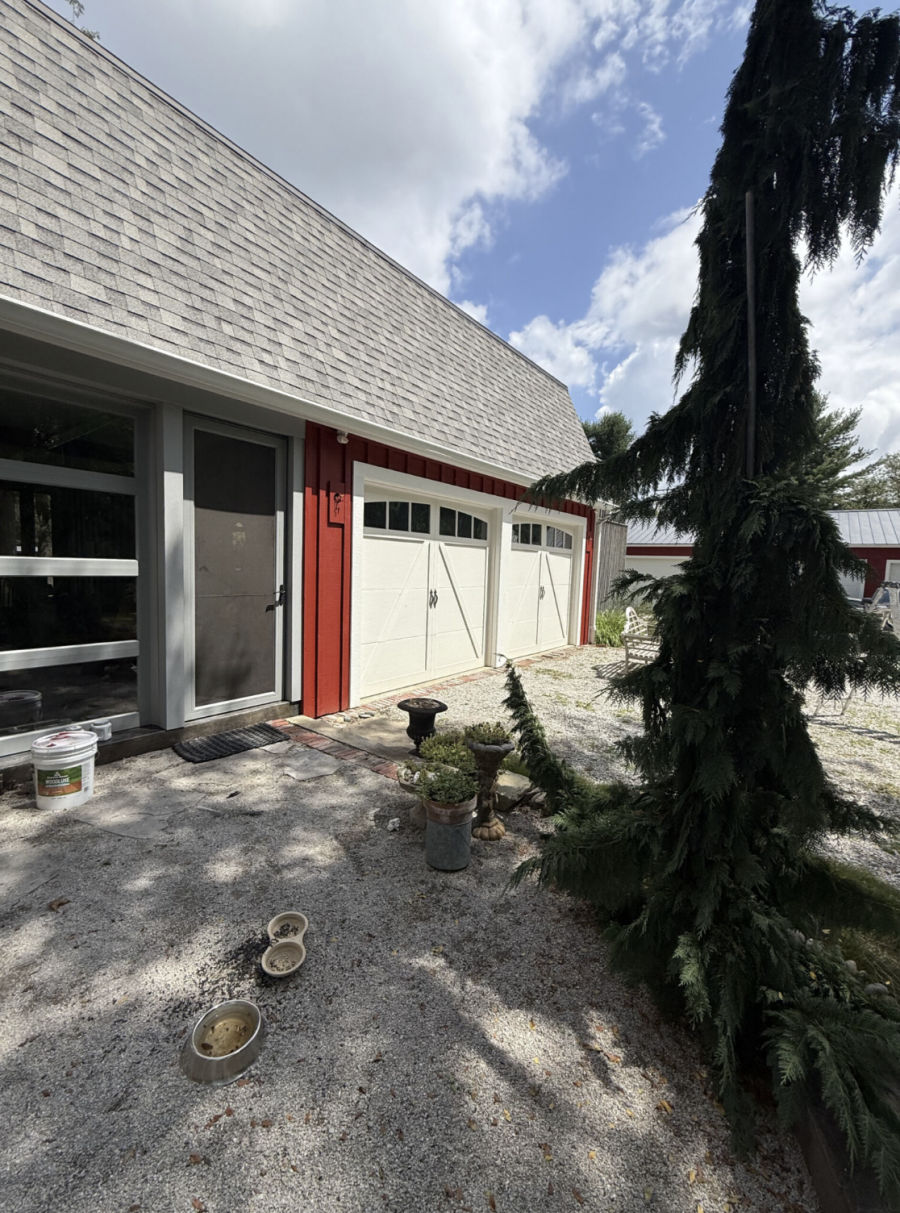 house with red stained wood siding and white trim Preview Image 4