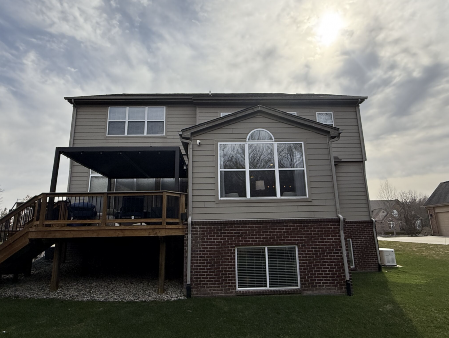 back of house with beige siding before repaint Preview Image 5