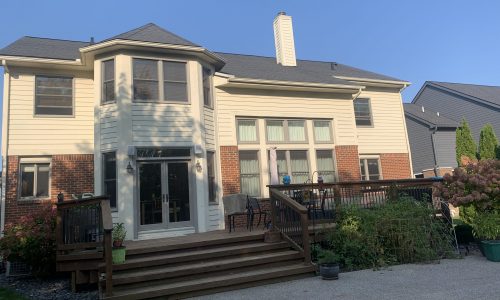 Brick and natural wood siding