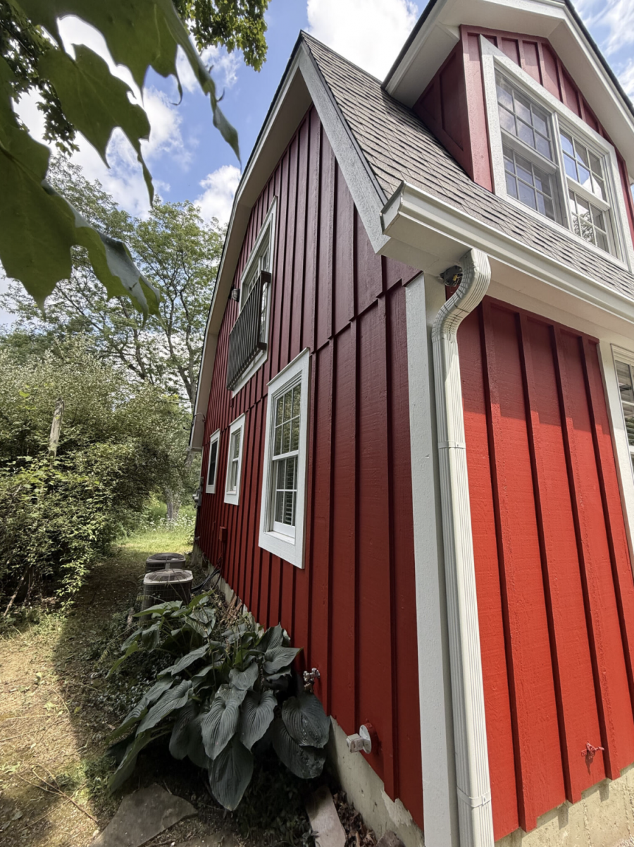 house with red stained wood siding and white trim Preview Image 2