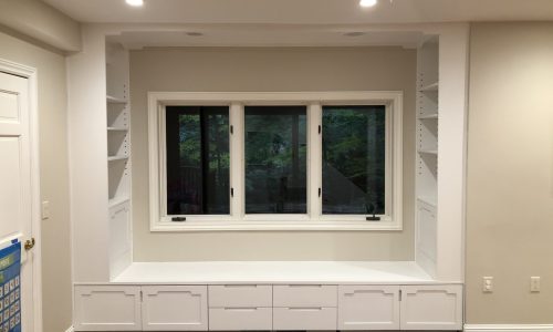 Built-in bench and shelves in white