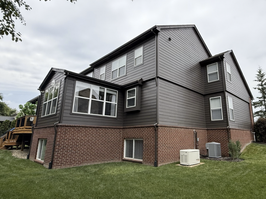 side of house with brick and dark grey painted siding Preview Image 2