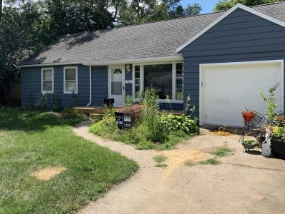 House with aluminum siding after being repainted.