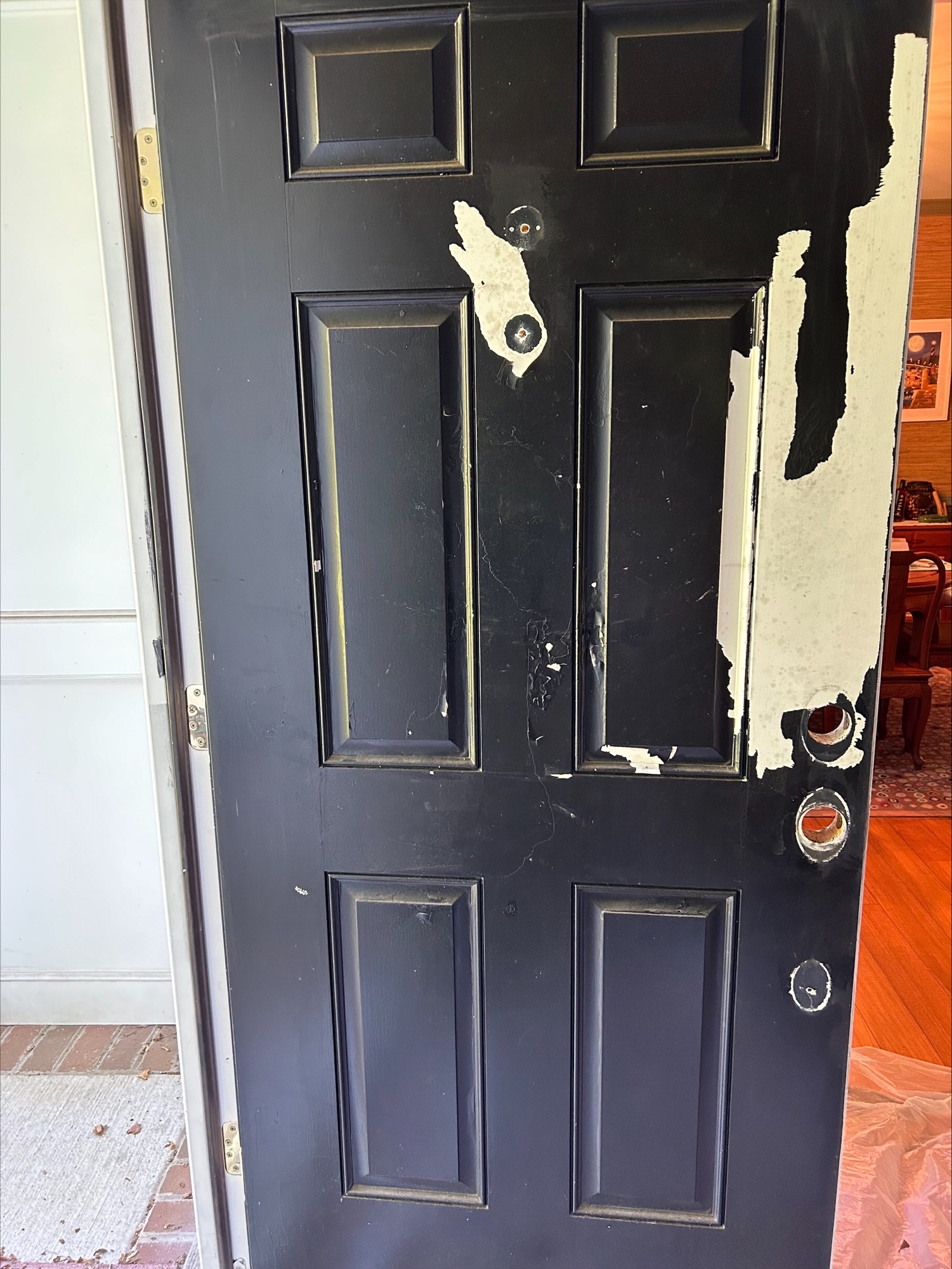 black door with faded and peeling paint in annapolis before photos exterior painting project by certapro painters of annapolis