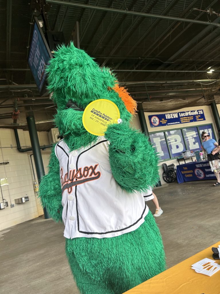 Bowie Baysox mascot Louie holding a certapro painters branded hand fan