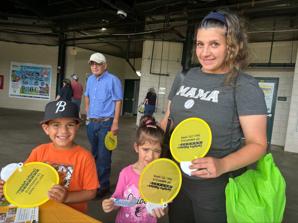 Baysox family with certapro hand fans