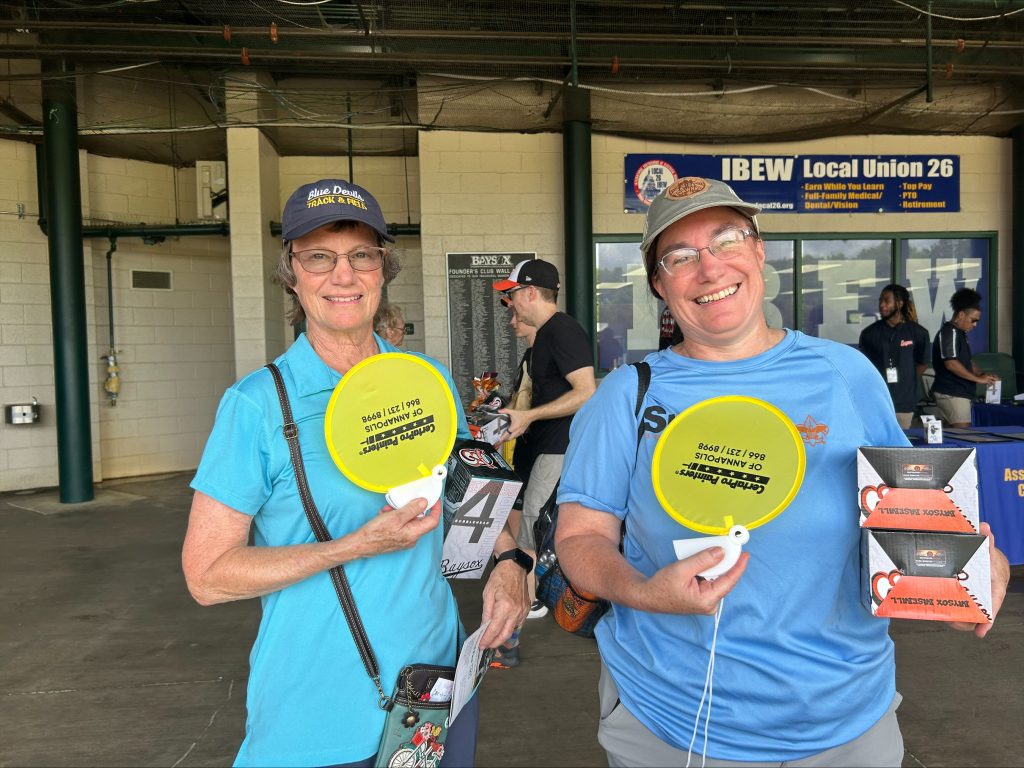 Two baysox fans with certapro hand fans