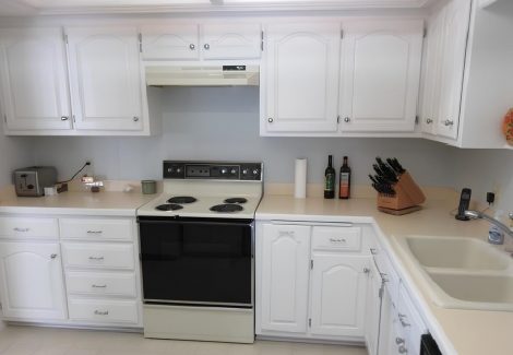 Brown Cabinets Repainted Modern White for Anoka Home