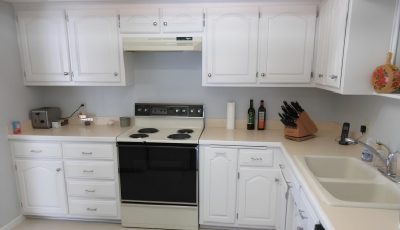 Brown Cabinets Repainted Modern White for Anoka Home
