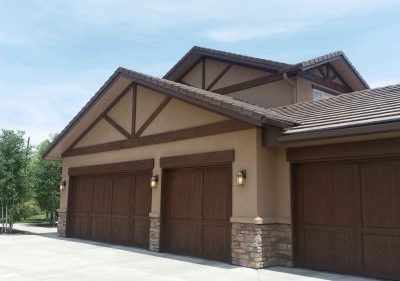 Exterior Residential Painting with stone walls and driveway