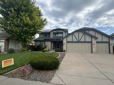 house exterior with stucco siding and blue painted trim