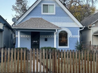 house exterior with blue siding and white trim