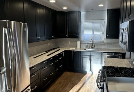Black Cabinets Repainted Vibrant Blue