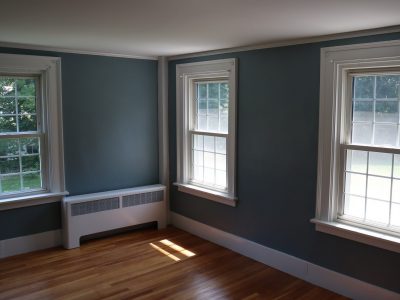 bedroom after professional repairs and painting