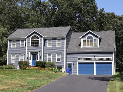 front of home with grey painted siding and white trim