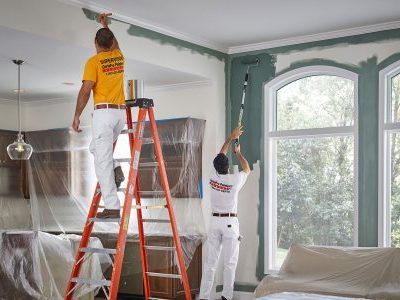 painters working on interior of a home