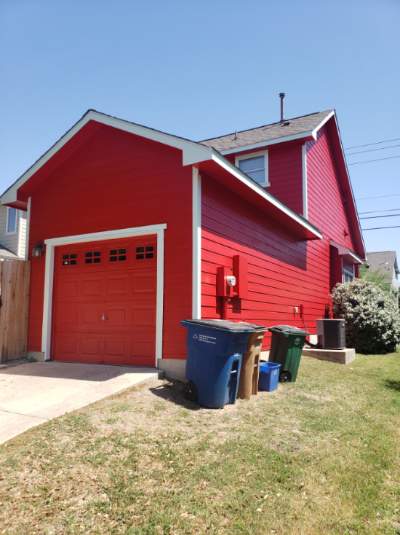 After Photo of Red exterior painting of house