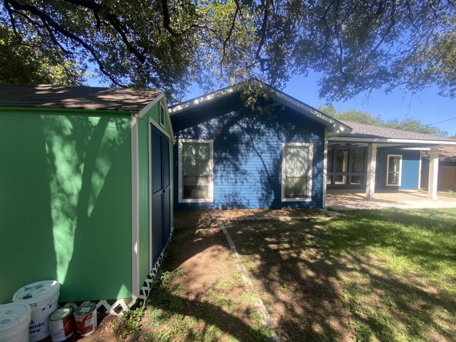 rear side of house with blue siding and green painted shed Preview Image 7