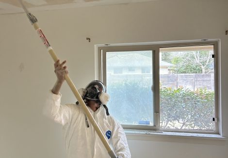 painter during popcorn ceiling removal
