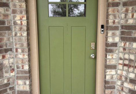 green painted front door of house