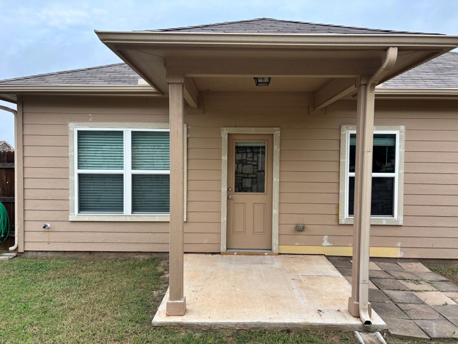 back door of tan house with small covered patio Preview Image 7