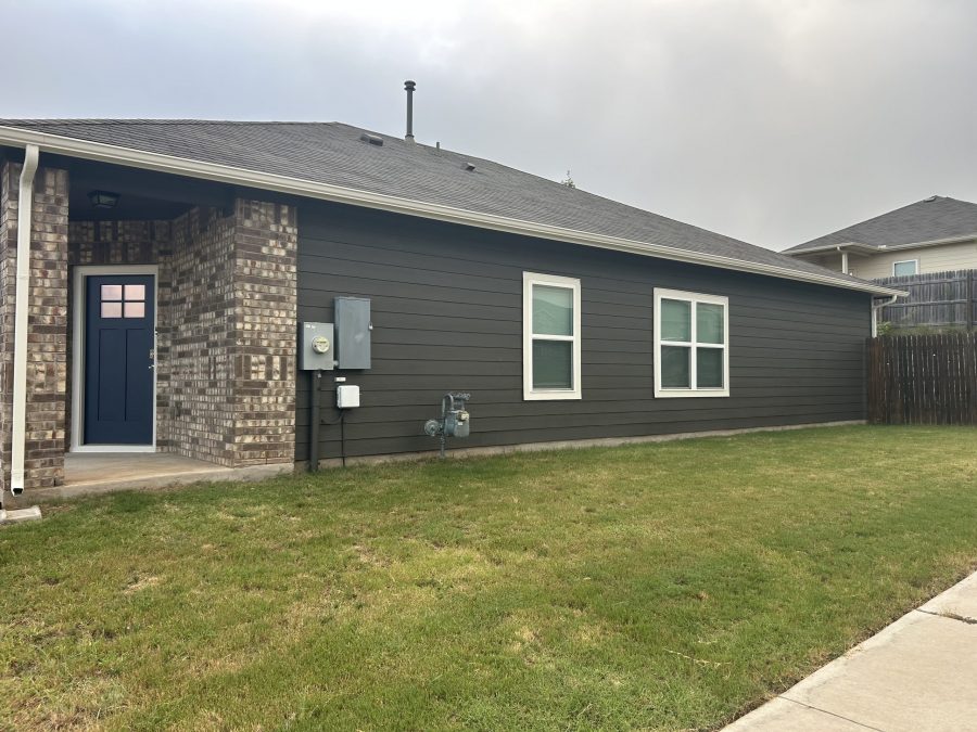 side of house with charcoal painted siding Preview Image 2
