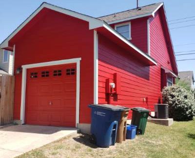After Photo of Red exterior painting of house