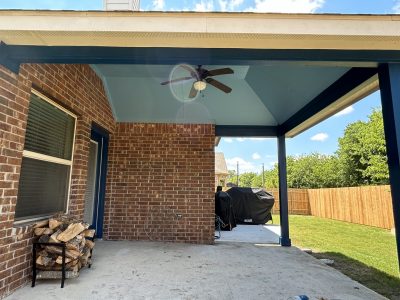 covered porch with two tone blue painted ceiling and posts