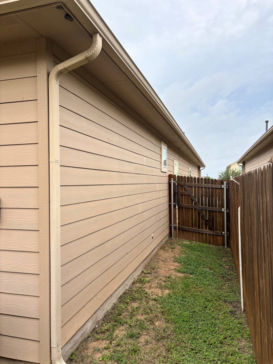 side of house with wooden fence attached Preview Image 11