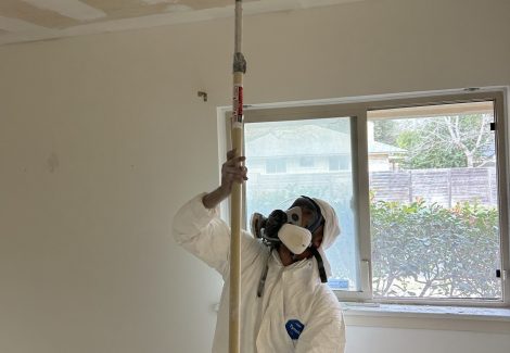 painter during popcorn ceiling removal
