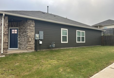 side of house with charcoal painted siding
