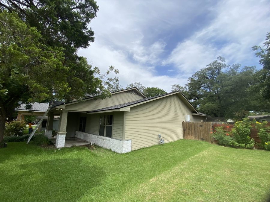 front yard and house with yellow siding and wooden fence Preview Image 12