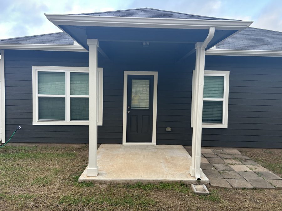 covered rear doorway of house with charcoal painted siding Preview Image 6