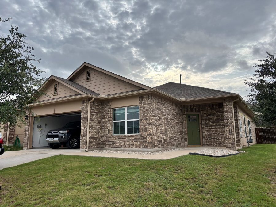 front corner of house with stone and tan siding Preview Image 1