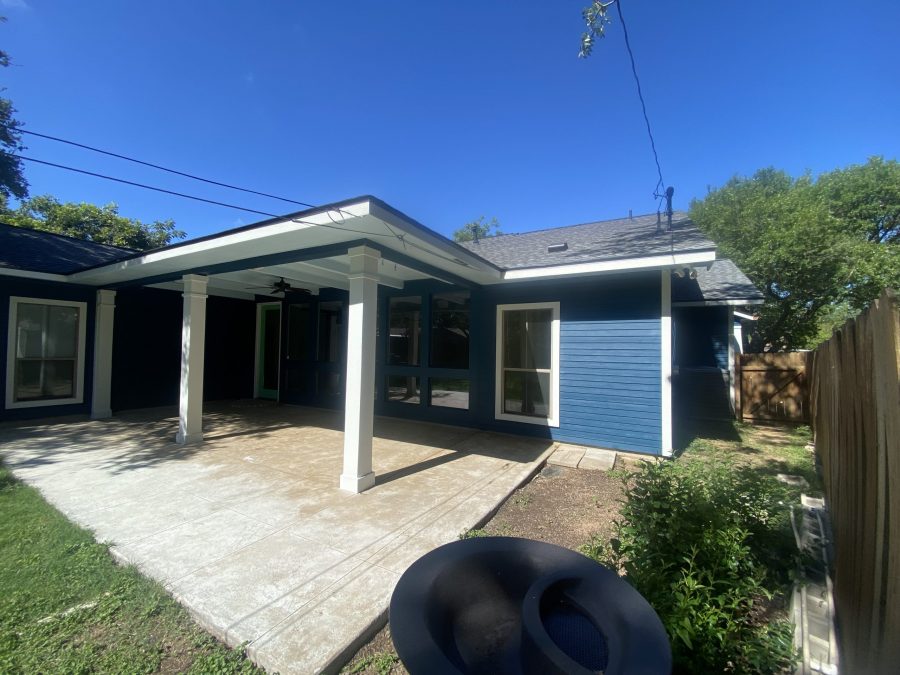 covered patio behind house with blue siding Preview Image 5