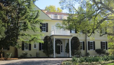Residential Exterior Painting - Pale Yellow with White Trim and Black Shutters