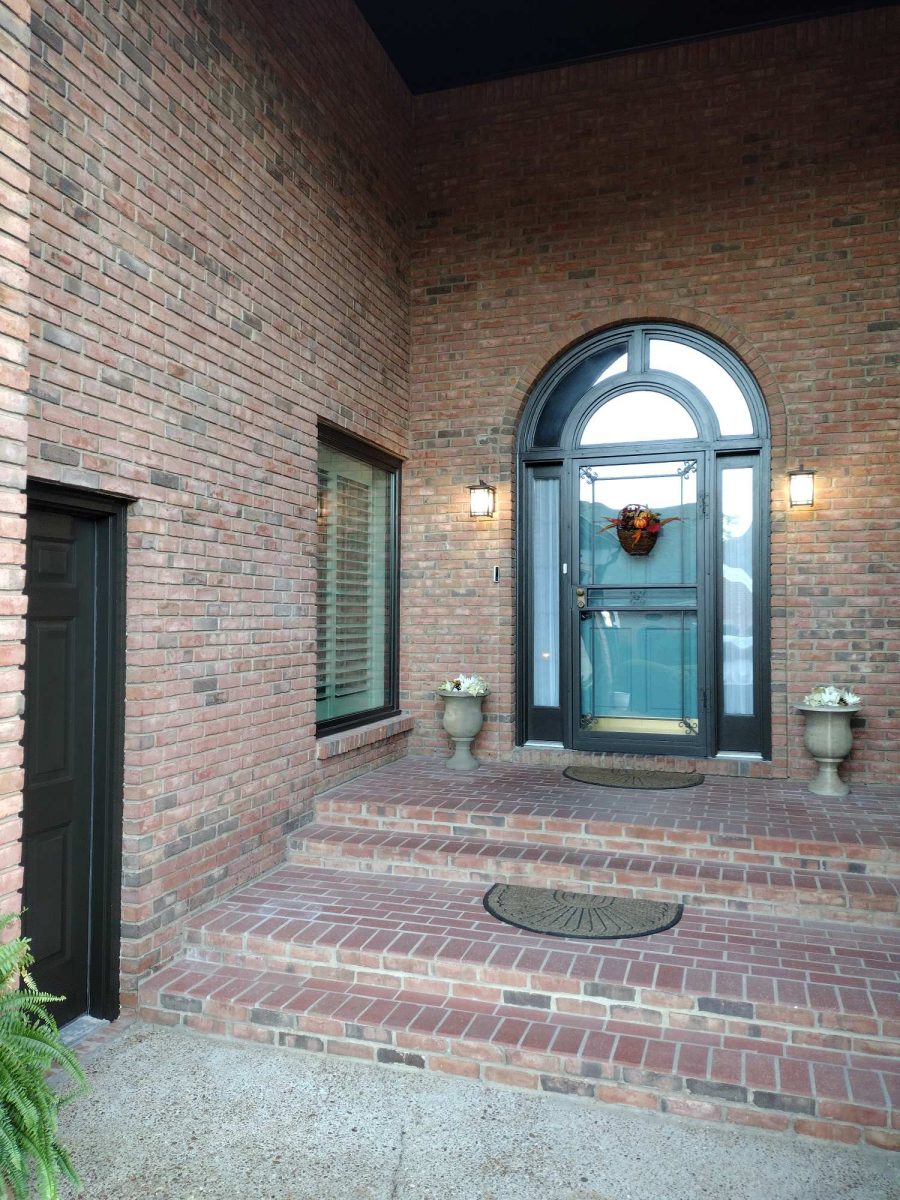brick home entryway with dark painted trim Preview Image 1